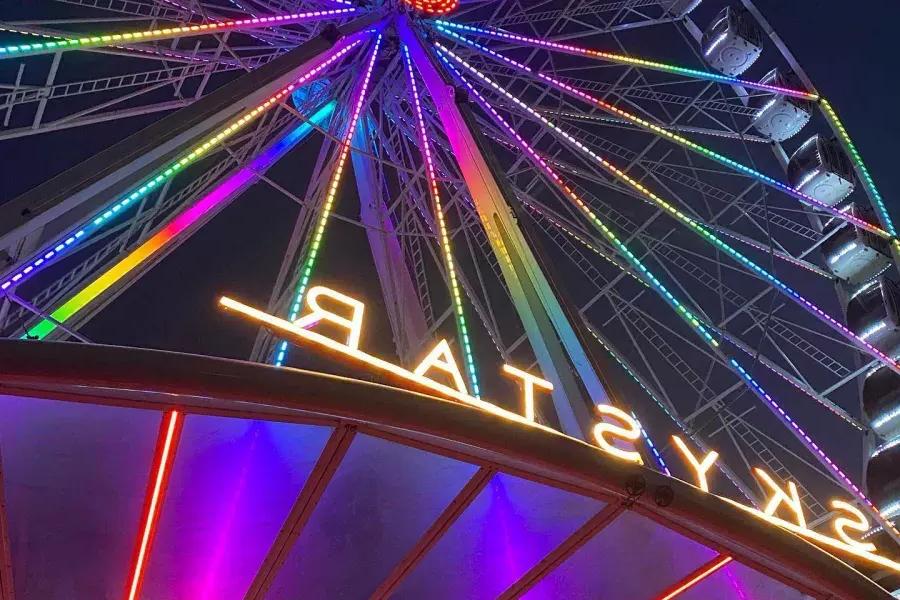 Close up view of the neon lights of the SkyStar ferris wheel in Golden Gate Park. San Francisco, California.